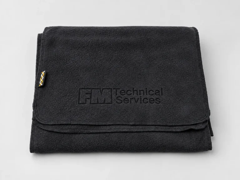 Black fleece scarf laser engraved with the FM Technical Services logo