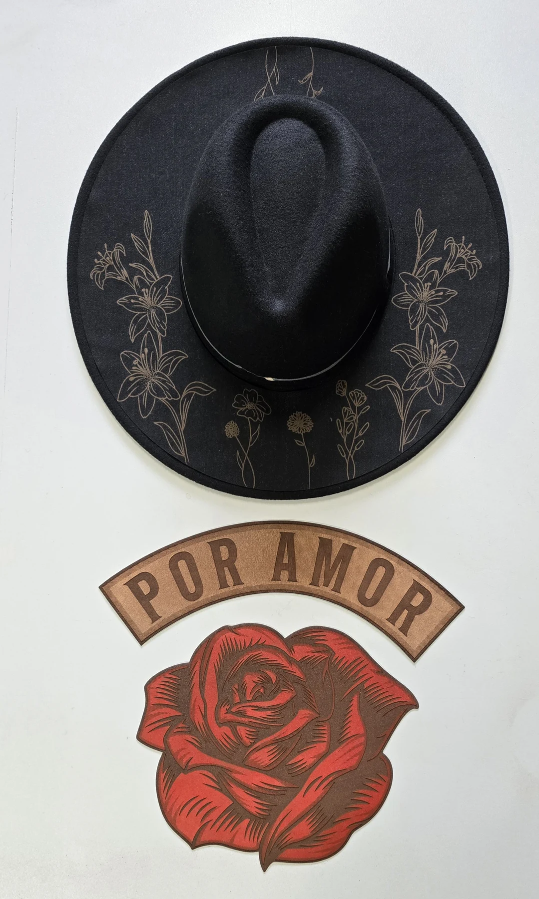 Felt hat with floral engraving and separate leather rose and POR AMOR components for The Fireflies